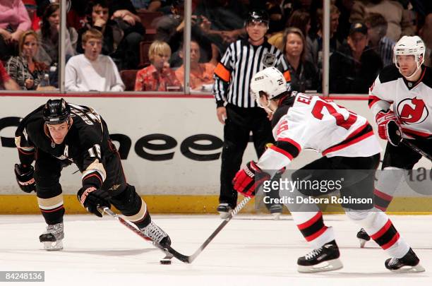 Patrik Elias of the New Jersey Devils reaches for the puck against Ryan Getzlaf of the Anaheim Ducks during the game on January 11, 2009 at Honda...