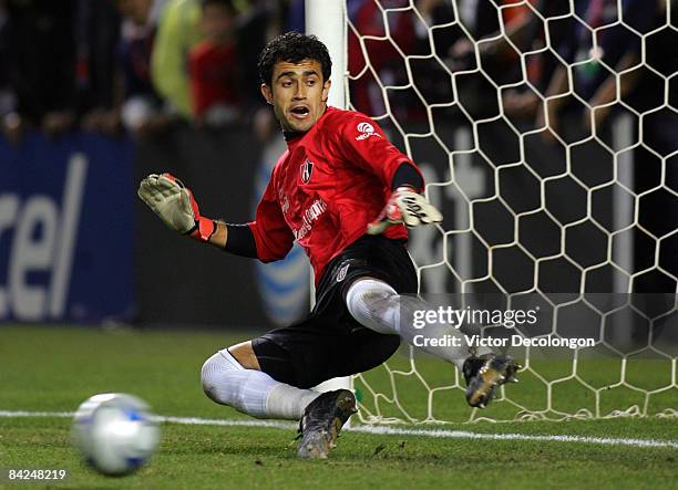 Goalkeeper Pedro Hernandez of Atlas watches the ball go into the net during penalty kicks in their InterLiga match against Pachuca FC at The Home...