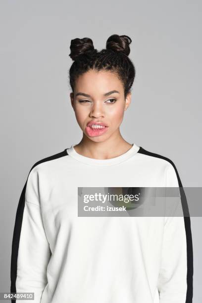 cute afro american teenager girl - grimacing stock pictures, royalty-free photos & images