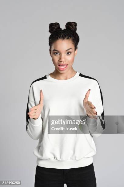 happy afro american teenager woman explaining - explaining stock pictures, royalty-free photos & images