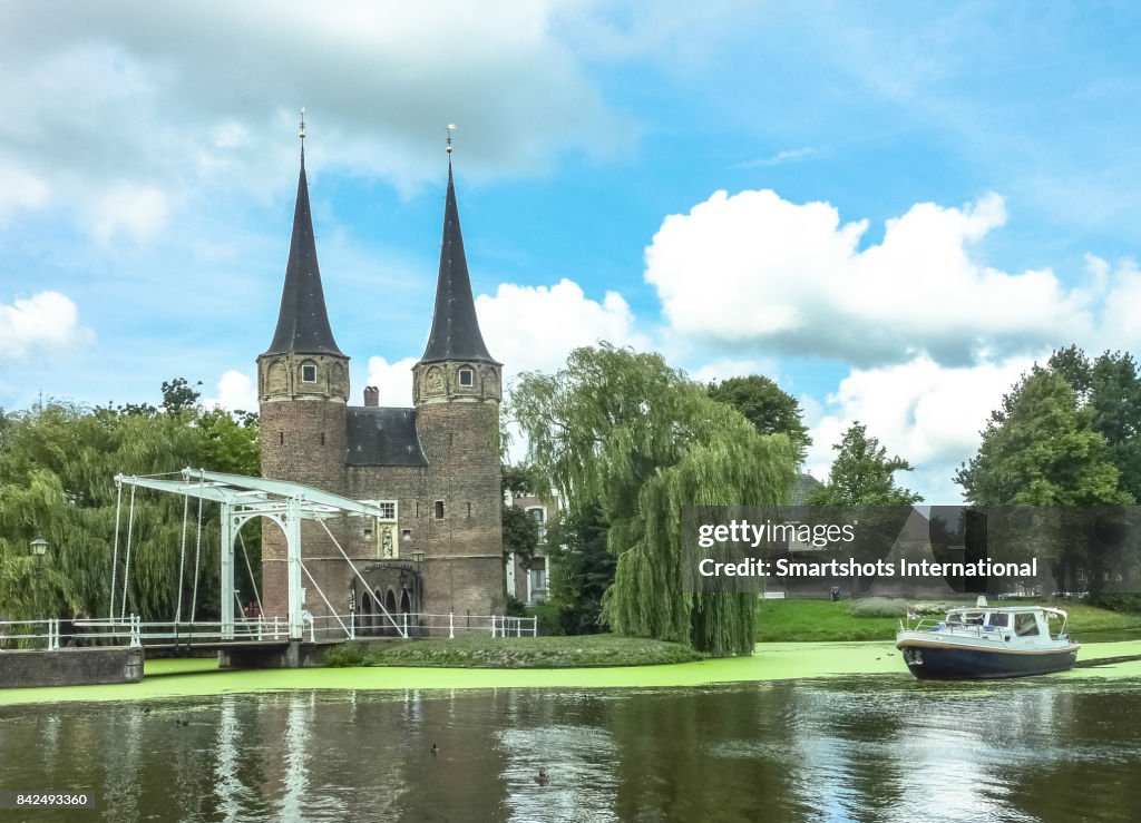 Oostpoort (Eastern Gate), a medieval dam gate with typical small white drawbridge in Delft, the Netherlands