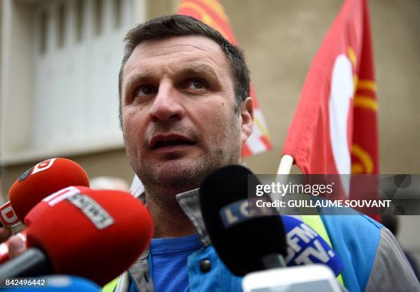 Unionist of the French auto parts manufacturer GM&S company, Yann Augras, speaks to the press outside the trade court of Poitiers, central France, on...