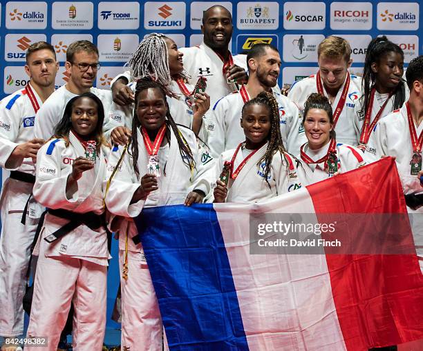 The French bronze medal winning judo team including, Teddy Riner, Amandine Buchard, Helene Receveaux, Clarisse Agbegnenou, Emilie Andeol and Axel...