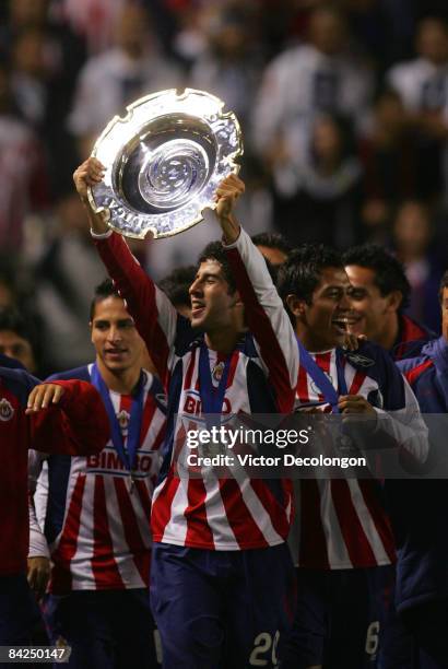 Edgar Mejia of CD Chivas USA holds up the InterLiga trophy after they defeated Morelia 4-2 in penalty kicks after a 1-1 draw during their InterLiga...