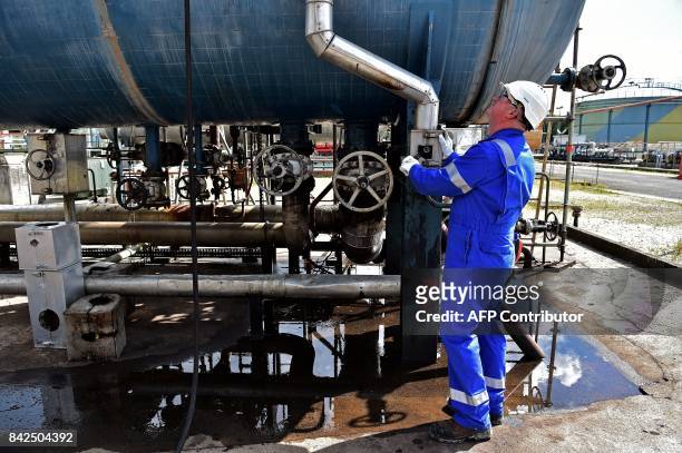 Technician works on oil installations on the premises of the Canadian oil company Vermilion Energy in Saint-Mery, some 50 km south-east of Paris on...