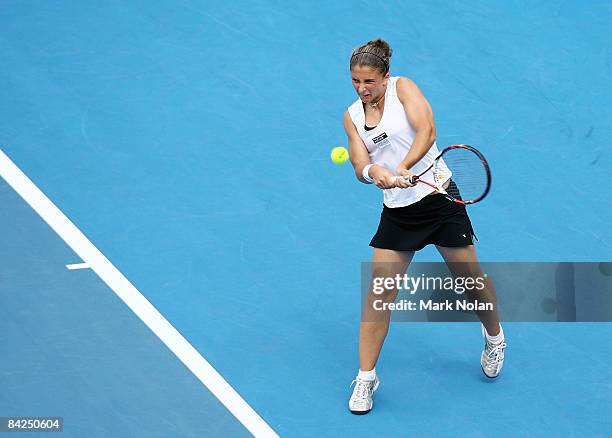 Sara Errani of Italy plays a backhand during the first round match against Casey Dellacqua of Australia during day two of the 2009 Medibank...