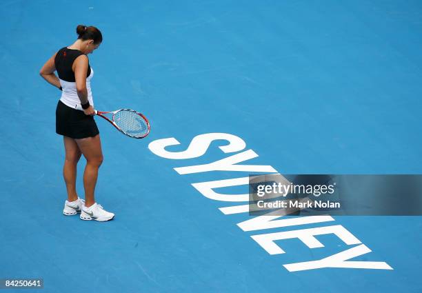 Casey Dellacqua of Australia looks dejected during the first round match against Sara Errani of Italy during day two of the 2009 Medibank...