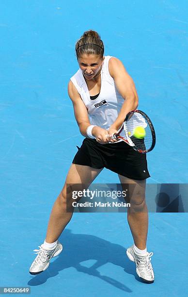 Sara Errani of Italy plays a backhand during the first round match against Casey Dellacqua of Australia during day two of the 2009 Medibank...