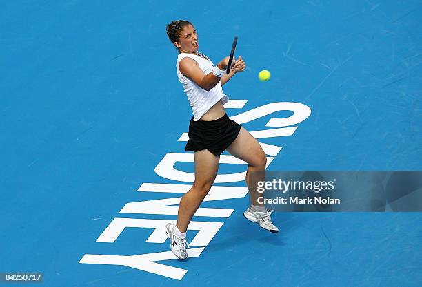 Sara Errani of Italy plays a forehand during the first round match against Casey Dellacqua of Australia during day two of the 2009 Medibank...