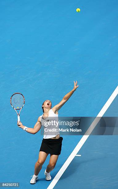 Sara Errani of Italy serves during the first round match against Casey Dellacqua of Australia during day two of the 2009 Medibank International at...