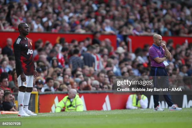 Andy Cole assistant head coach / manager of Manchester United Legends and Albert Ferrer head coach / manager of FC Barcelona Legends during the match...