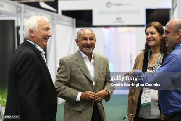 Ossie Ardiles and Mike Summerbee talk to exhibitors during day 1 of the Soccerex Global Convention at Manchester Central Convention Complex on...