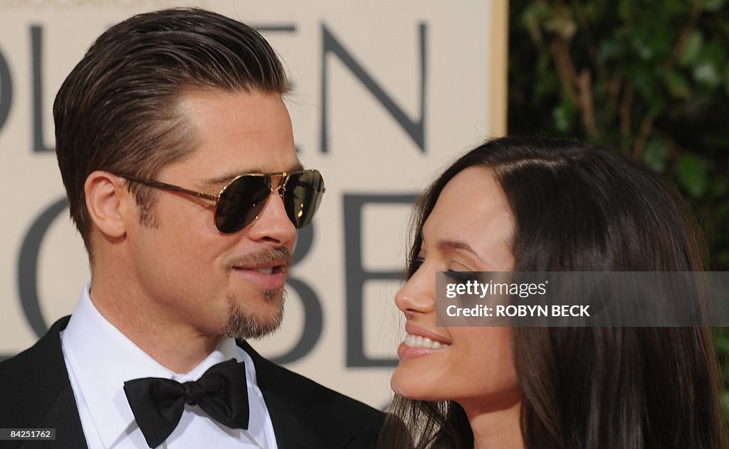 Actors Angelina Jolie (R) and Brad Pitt