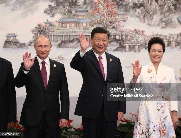 Russian President Vladimir Putin, Chinese President Xi Jinping, his wife Peng Liyuan pose for a photo prior to the dinner on September 4, 2017 in...