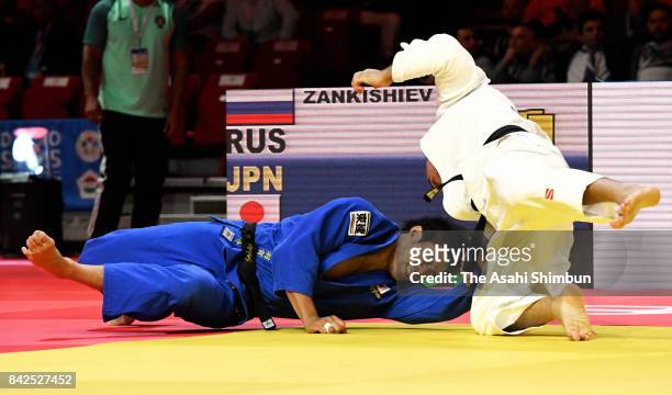 Ryunosuke Haga of Japan and Kazbek Zankishiev of Russia compete in the Men's -100kg second round during day six of the World Judo Championships at...