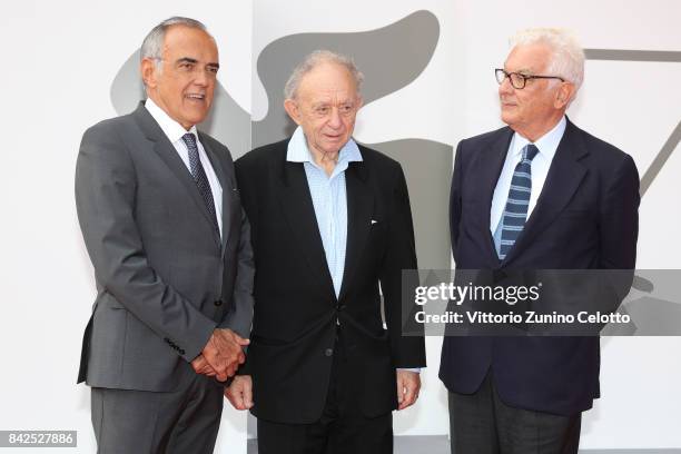 Festival director Alberto Barbera, Frederick Wiseman and President of the festival Paolo Baratta walk the red carpet ahead of the 'Ex Libris. The New...