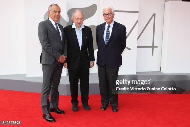 Festival director Alberto Barbera, Frederick Wiseman and President of the festival Paolo Baratta walk the red carpet ahead of the 'Ex Libris. The New...