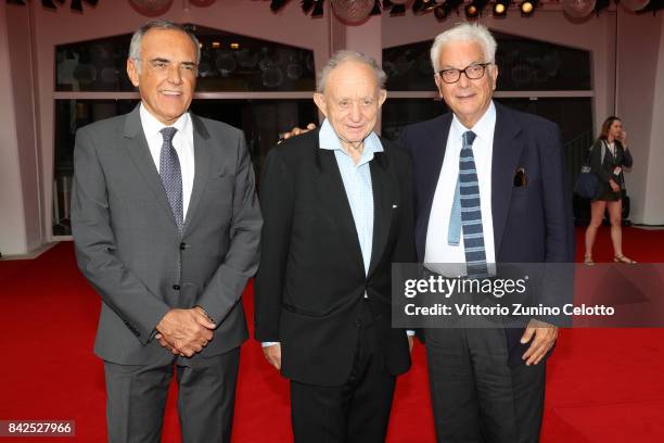 Festival director Alberto Barbera, Frederick Wiseman and President of the festival Paolo Baratta walk the red carpet ahead of the 'Ex Libris. The New...