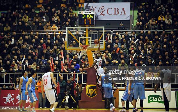 Basket-CHN-NBA-CBA-Wells" by Robert Saiget Former NBA star Bonzi Wells slam dunks unopposed as he leads Shanxi to victory over the Beijing Ducks...