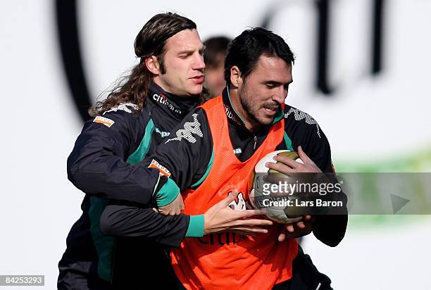 Torsten Frings holds Hugo Almeida during a training session during day five of Werder Bremen training camp on January 12, 2009 in Belek, Turkey.