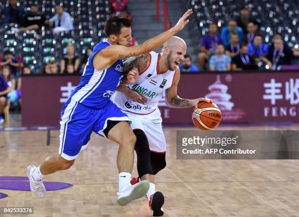 David Vojvoda of Hungary vies with Jakub Sirina of Czech Republic during Group C of the FIBA Eurobasket 2017 mens basketball match between Hungary...