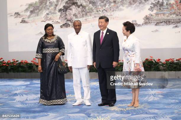 Guinea's First Lady Djebe Kaba Conde, Guinea's President Alpha Conde, Chinese President Xi Jinping, his wife Peng Liyuanpose for a photo prior to the...