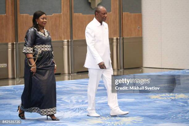 Guinea's First Lady Djebe Kaba Conde and Guinea's President Alpha Conde arrive to the welcoming ceremony prior to the dinner on September 4, 2017 in...