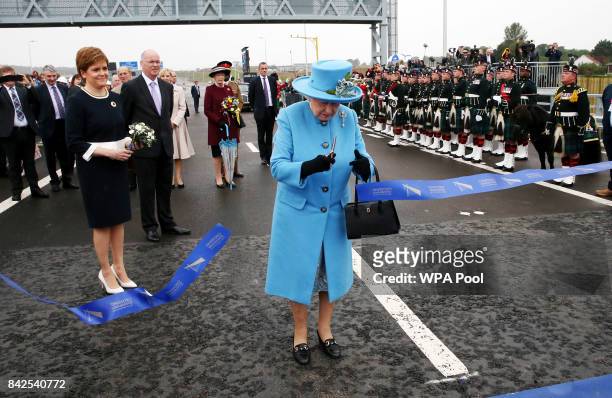 Queen Elizabeth II officially opens the Queensferry Crossing as Prince Philip, Duke of Edinburgh and First Minister Nicola Sturgeon look on during...