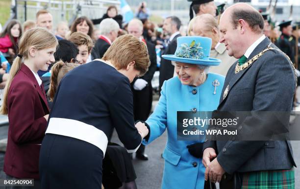 Queen Elizabeth II is greeted by First Minister Nicola Sturgeon during the official opening ceremony of the Queensferry Crossing, on September 4,...
