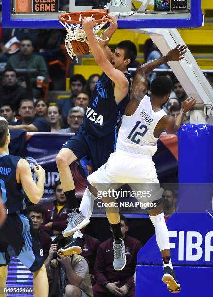 Nicolas Brussino of Argentina dunks the ball against Darrun Hilliard II of United States during the FIBA Americup final match between US and...