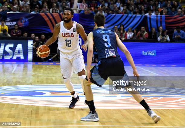 Darrun Hilliard II of United States challenges Nicolas Brussino of Argentina during the FIBA Americup final match between US and Argentina at Orfeo...