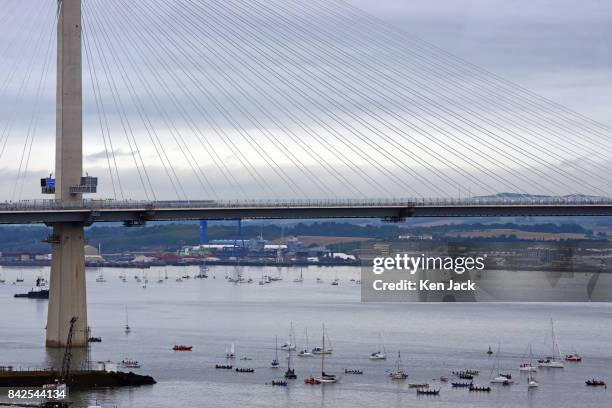 Two flotillas of small craft on either side of the Queensferry Crossing road bridge over the Forth Estuary take part in the celebrations on the day...