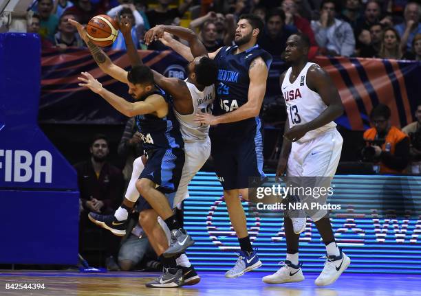 Nicolas Laprovittola and Patricio Garino of Argentina fight for ball with Darrun Hilliard II and Jameel Warney of United States during the FIBA...