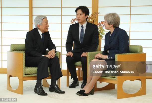 Emperor Akihito and British Prime Minister Theresa May talk during their meeting at the Imperial Palace on September 1, 2017 in Tokyo, Japan.