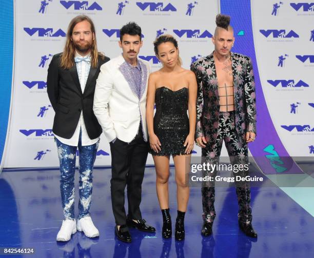 Joe Jonas, Jack Lawless, Cole Whittle and JinJoo Lee of DNCE arrive at the 2017 MTV Video Music Awards at The Forum on August 27, 2017 in Inglewood,...