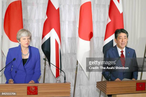 British Prime Minister Theresa May and Japanese Prime Minister Shinzo Abe attend a joint press conference following their meeting at Akasaka State...