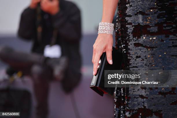 Micaela Ramazzoti , bag detail, walks the red carpet ahead of the 'Una Famiglia' screening during the 74th Venice Film Festival at Sala Grande on...