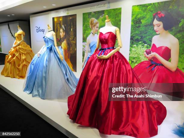 Colorful wedding dresses representing six popular Disney princesses are displayed on August 30, 2017 in Tokyo, Japan. Fourteen designs featuring six...