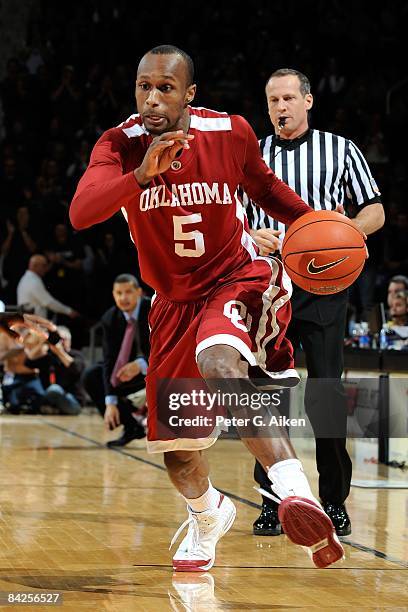 Guard Tony Crocker of the Oklahoma Sooners drives the ball up court against the Kansas State Wildcats during the first half on January 10, 2009 at...