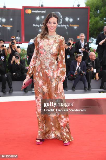 Alessia Fabiani walks the red carpet ahead of the 'Una Famiglia' screening during the 74th Venice Film Festival at Sala Grande on September 4, 2017...