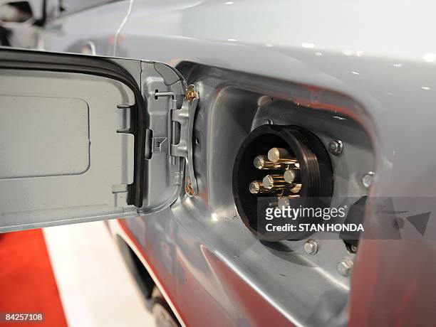 Charging conecting plug for the Chinese BYD e6 electric car is introduced during a press preview at the North American International Auto Show...