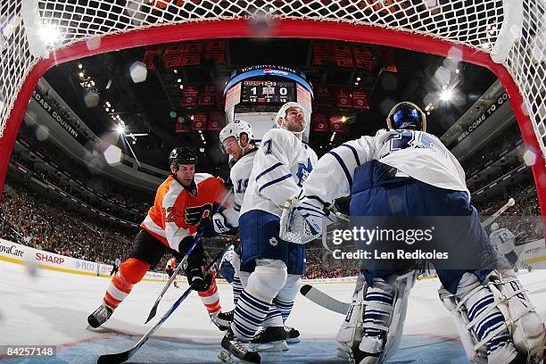 Net cam view of Mike Knuble of the Philadelphia Flyers as he skates through the crease against Dominic Moore, Ian White and Vesa Toskala the Toronto...