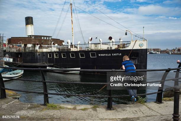 Young boy fishes next to Hartlepool Maritime Museum on September 4, 2017 in Hartlepool, England. Hartlepool in the North East of England, is one of...
