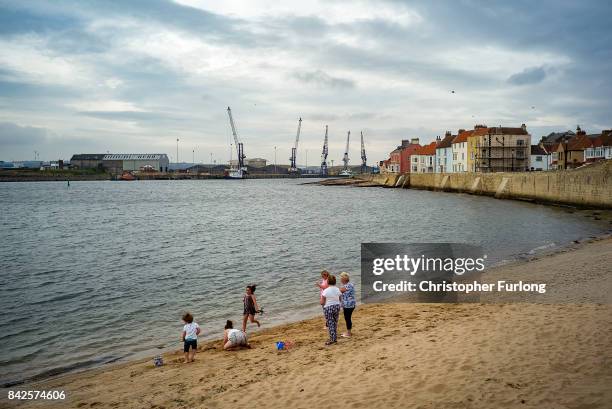 Locals spend time on the beach near the docks in the Headland area of Hartlepool,on September 4, 2017 in Hartlepool, England. Hartlepool in the North...