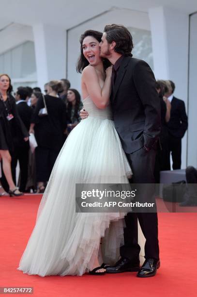 Actress Matilda de Angelis and Italian actor Andrea Arcangeli kiss on the red carpet before the premiere of the movie "Una Famiglia" presented in...
