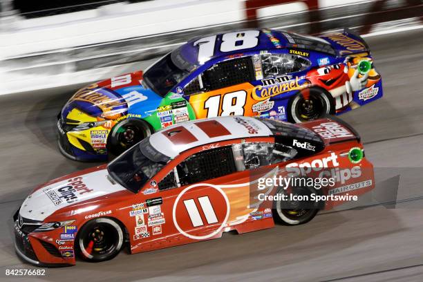 Denny Hamlin Joe Gibbs Racing Sport Clips Toyota Camry and Kyle Busch Joe Gibbs Racing M&M?s Caramel Toyota Camry during the Bojangles Southern 500...