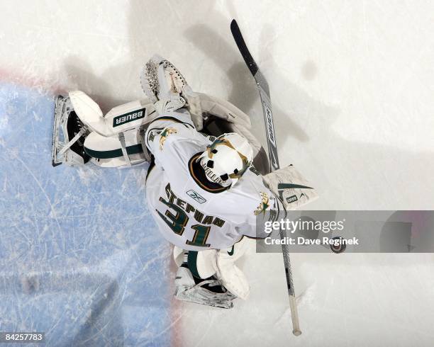 Goalie Tobias Stephan of the Dallas Stars makes a save in warm-ups before a NHL game against the Detroit Red Wings on January 8, 2009 at Joe Louis...