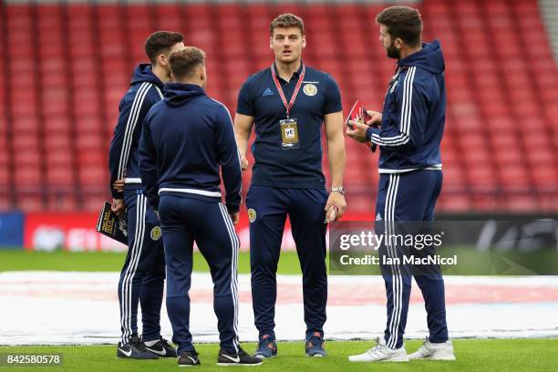 Chris Martin of Scotland and team mates walk on the pitch prior to the FIFA 2018 World Cup Qualifier between Scotland and Malta at Hampden Park on...