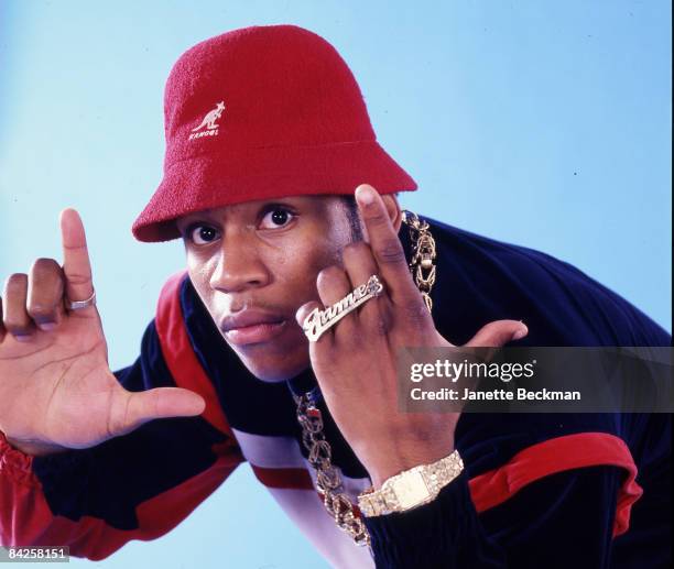 Rapper LL Cool J , real name James Todd Smith, makes hand gestures while posing for a studio portrait, 1986 New York. He is wearing a red Kangol...