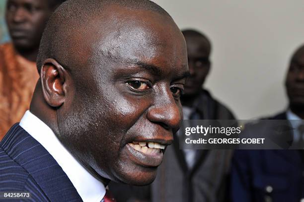 Former Senegalese Prime minister Idrissa Seck answers questions after his meeting with Senegalese President Abdoulaye Wade in Dakar on January 12,...